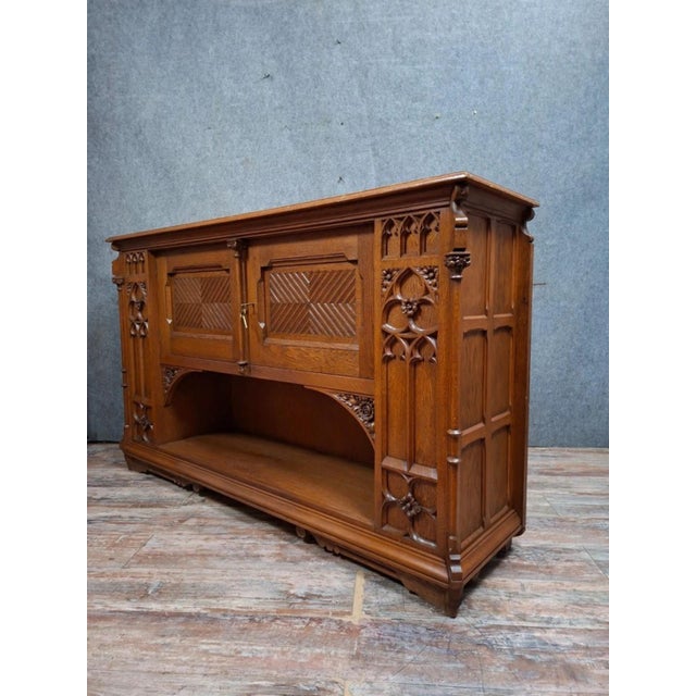 Large Antique Carved Oak Buffet – Gothic/Neo-Gothic Style / 20th Century This magnificent large antique buffet is crafted...