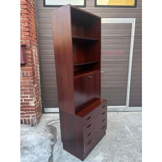 Rosewood Standing Bar Cabinet. When door opens light turns on in the mirrored Bar area. 2 adjustable glass shelves in the...