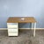 Iconic doctor's desk with a beautiful vintage patina. The drawer unit and the square steel tube frame are finished in...