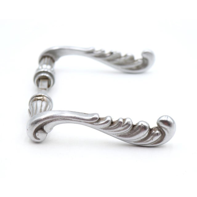 Reclaimed swirl passage door levers made from nickel plated brass. Priced as a pair of levers with a spindle. Good...