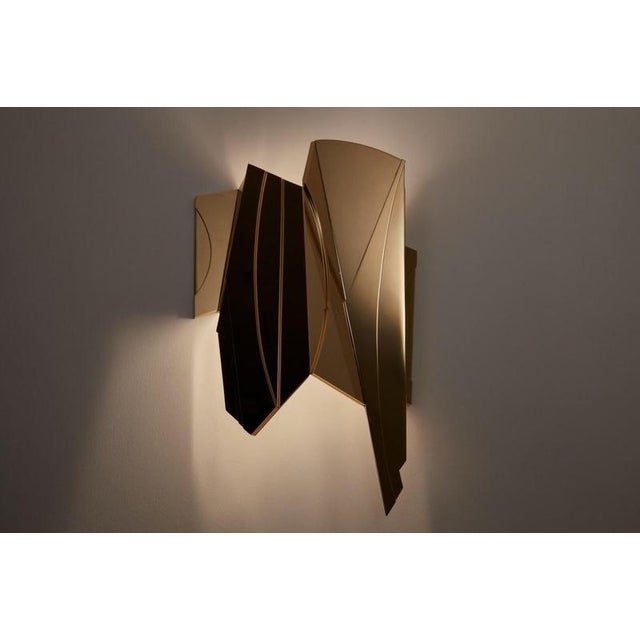 Geometric cross bitume 02 wall lamp by jennifer midoz dimensions: d 28 x w 11,5 x h 40 cm materials: pale gold on polished...