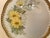 Beautiful hand painted gold rim plate with yellow floral pattern and pierced all around edge.