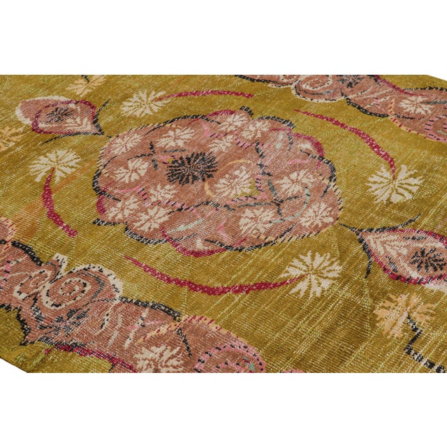 Hand-knotted in wool and originating from Turkey circa 1960 – 1970, this 5x9 vintage Zeki Müren rug is a unique addition...