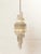 Light up your space with an assortment of one-of-a-kind and vintage pendants lights, chandeliers, and hanging lighting.