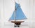 Made in England in the twentieth century, this pond yacht takes the form of a gaff-rigged cutter and is carved in wood....