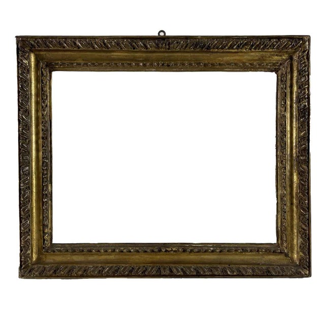 Pair of Roman Gilded Frames, 1700. A rare pair of antique Empire frames in carved and gilded wood, Rome, 18th century....