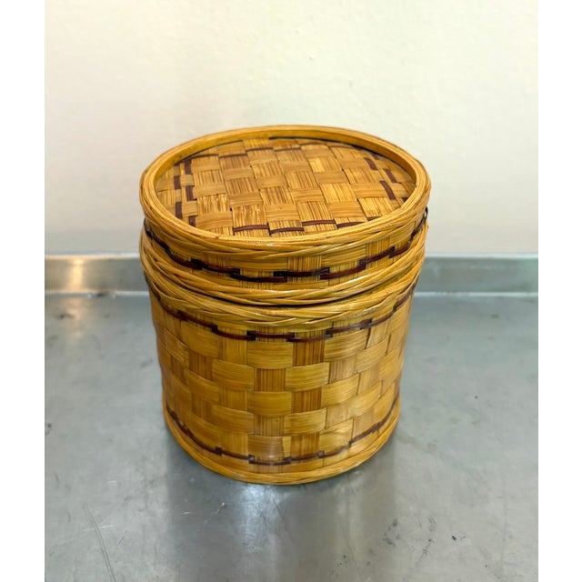 1940s-50s wicker-wrapped metal enameled canister/jar w/ lid. Some very minor discoloration at bottom/base area in a few...