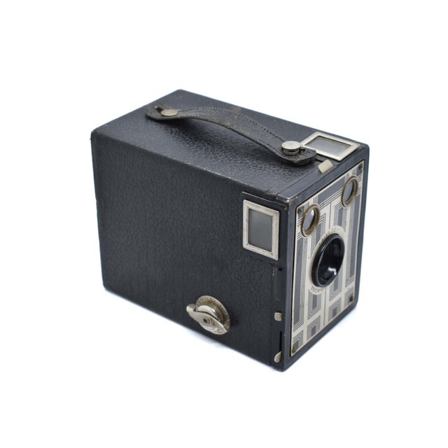 This striking Kodak Six-20 Brownie Junior is a quintessential example of Art Deco industrial design from the mid-1930s...