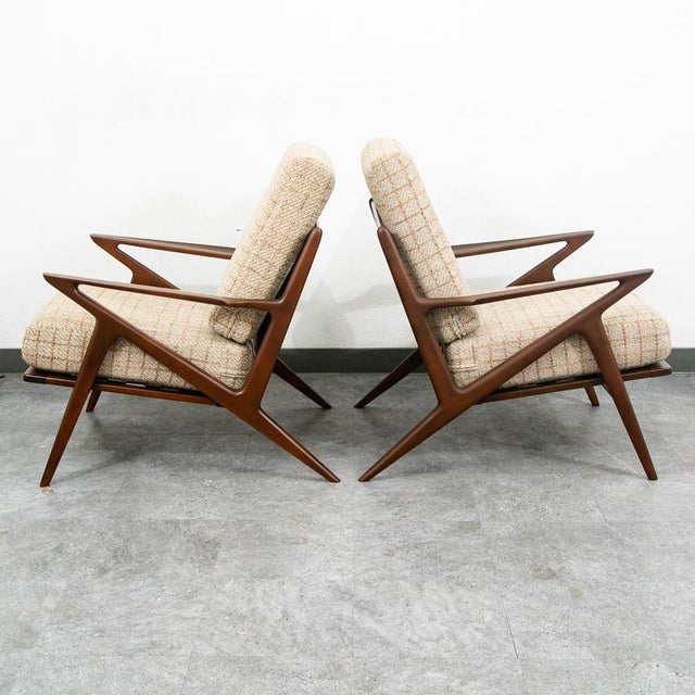 Mid-century Danish sculptural lounge chair set designed by Poul Jensen for Selig, showcasing a dramatic angular form with...