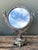 This exquisite vintage table mirror captures the timeless elegance of Neoclassical and Empire design revival. Crafted from...