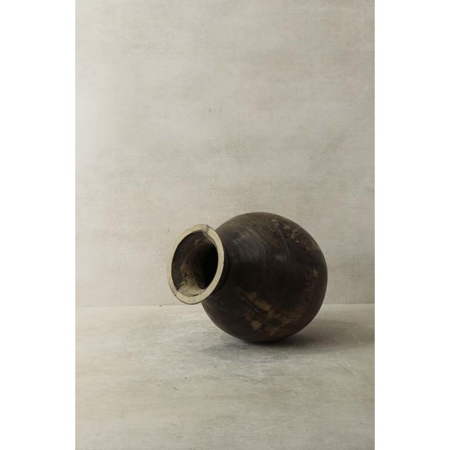 A vintage teak vase is a timeless masterpiece crafted from teak wood, known for its rich grain patterns and lustrous...