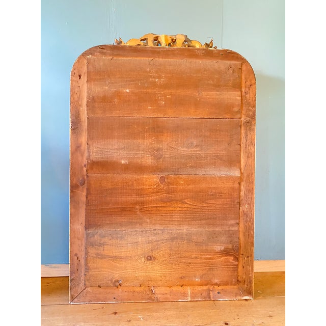 Large 19th-century Napoleon III period fireplace mirror in stuccoed and gilded wood. Part of the gilding is done with gold...