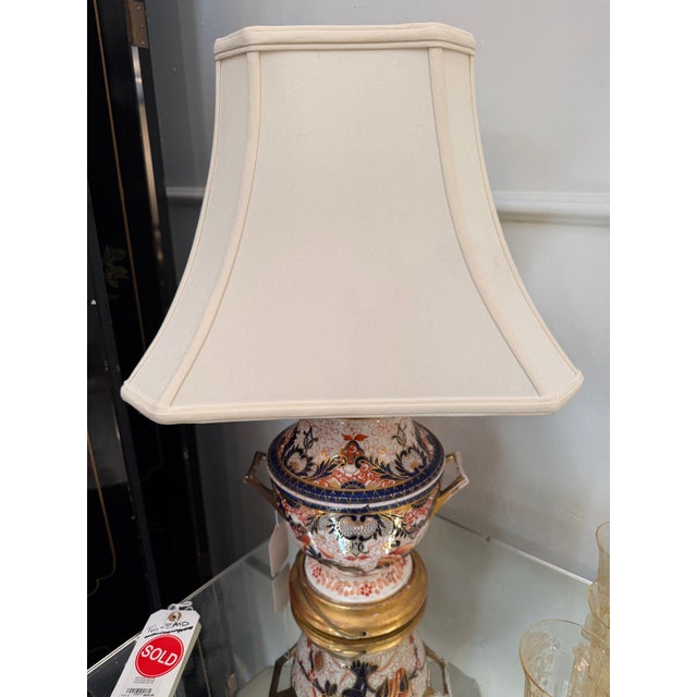 An exceptional antique 19th-century English porcelain twin-handled urn, beautifully converted into a stately classical...