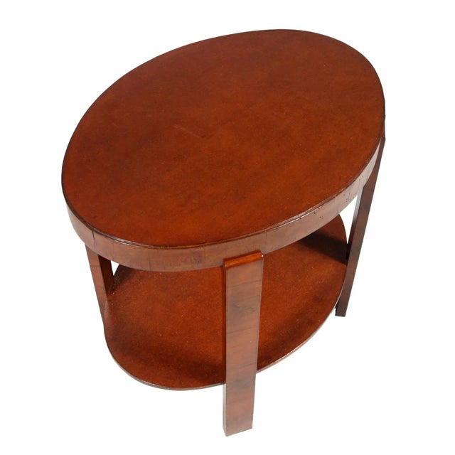 Oval side table or coffee table Art Deco by Osvaldo Borsani in veneered walnut with lynx eye veneer top. This piece has an...
