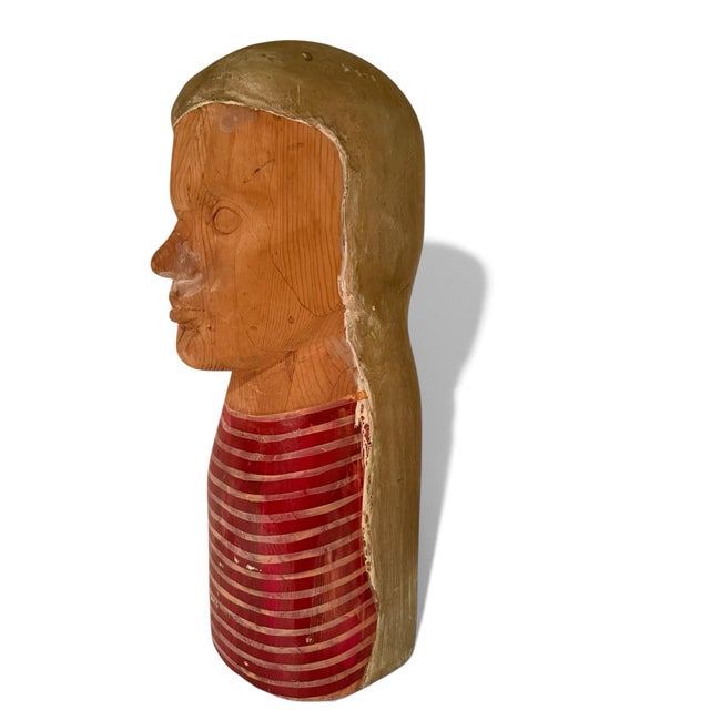 Fantastic carved barbershop bust from the 1940's. Finely carved face with long flowing hair, wearing a red-striped shirt....