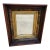 This is a stunning 19th-century antique wall mirror showcasing a beautifully crafted solid walnut frame with a rich, deep...