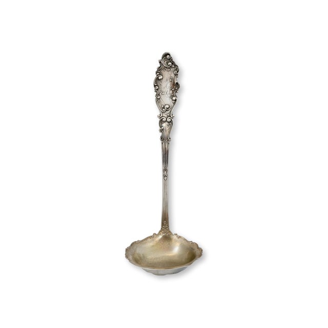 Mid 20th century Gorham sterling silver soup ladle in the elegant Luxembourg pattern. The richly sculpted Rococo style...