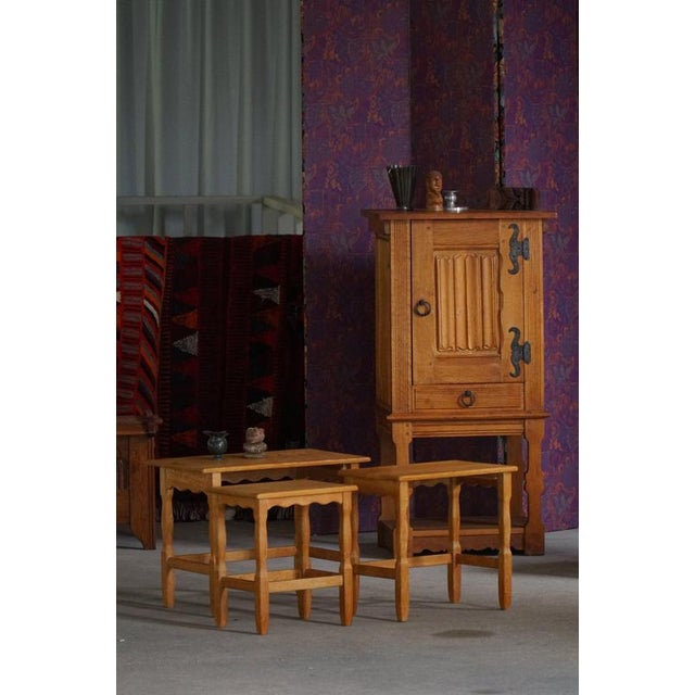 A refined set of three Danish Modern nesting tables crafted in oak, dating to the 1960s, made by a Danish cabinetmaker....