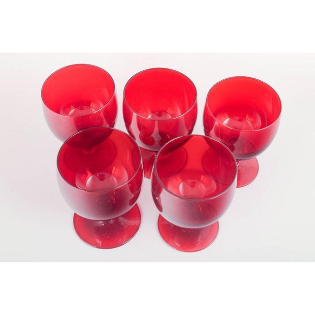 Monica Bratt for Reijmyre Glasbruk 5 red wine glasses, 1950s. Set of five ruby-red red wine glasses with rounded bowls and...