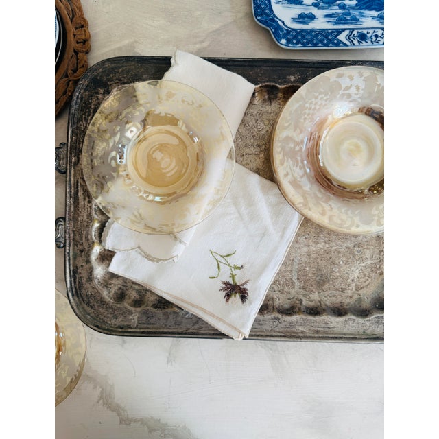 A refined set of eight Bohemian amber glass plates featuring a beautifully detailed acid-etched heraldic scene of a...