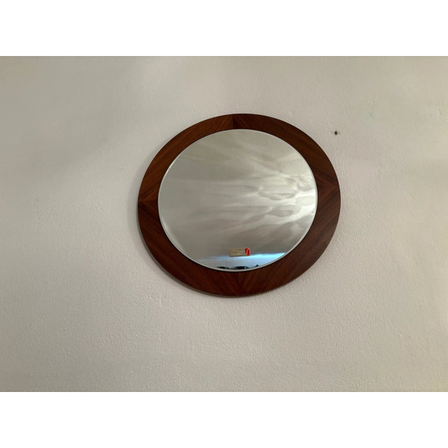 Scandinavian-style crystal mirror from the 1970s. In very good original condition. Excellent craftsmanship, made of walnut...