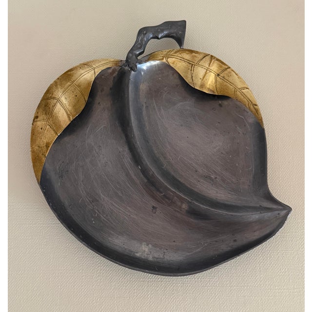 Heavy large metal bowl in the shape of a peaches brass leaves. Still retains the sticker from Saks Fifth Ave. Made in Hong...