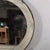 Originally a wagon wheel with an iron rim, the spokes have been removed and a mirror added to make a sophisticated rustic...