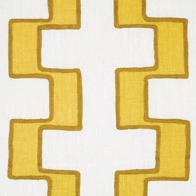 A series of stepped lines is handprinted with pigment ink on a Linen ground and then embroidered along the edges to amp up...