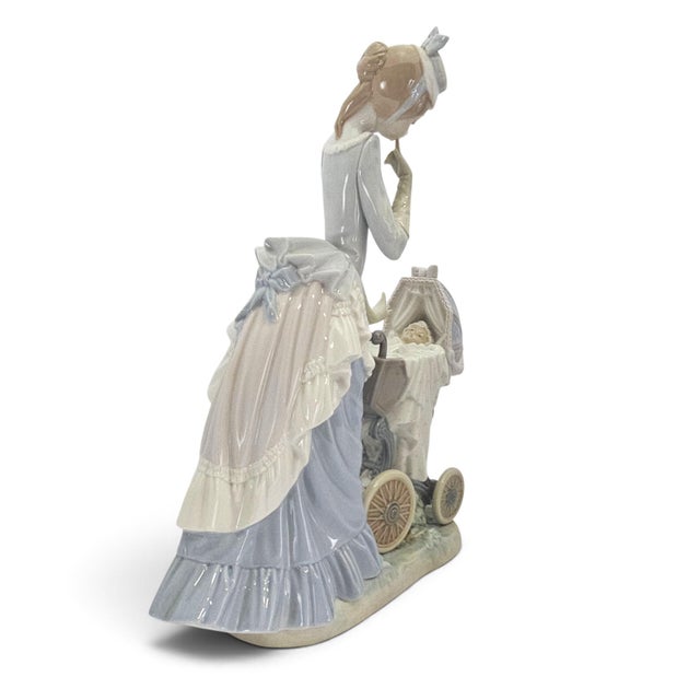 A substantial Lladró Baby's Outing porcelain figural group, model #4938, produced in Spain during the late 20th century....