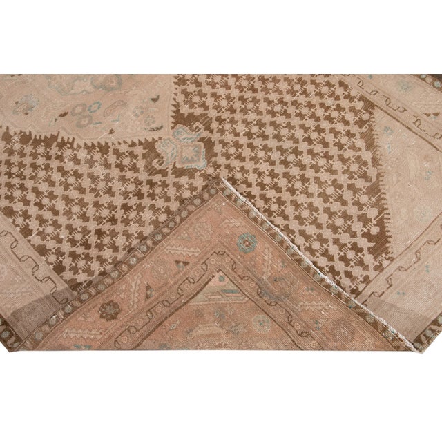 Beautiful antique Malayer Distressed hand-knotted wool runner with a brownfield. This Malayer rug has accents of peach and...