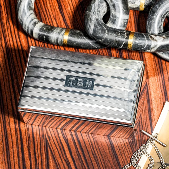 A gleaming testament to the elegance of the Art Deco era, this antique sterling silver jewelry and trinket box by Ahrendt...