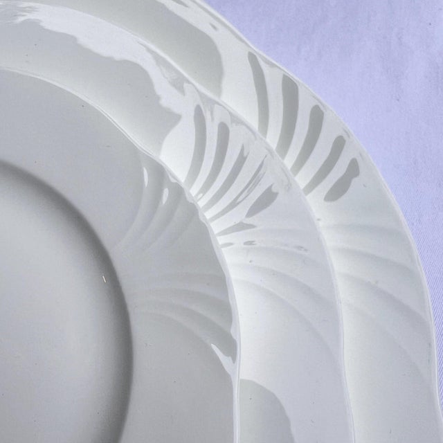 This is a beautiful set of Villeroy and Boch bone china dishes that have a simple, yet elegant, design that makes them...