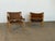 This pair of Sirocco safari chairs was designed by Arne Norell and produced in Sweden, confirmed by the manufacturer's...