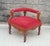 An antique Eastlake corner chair on casters with wine color velveteen upholstery. This antique chair is unique and has...