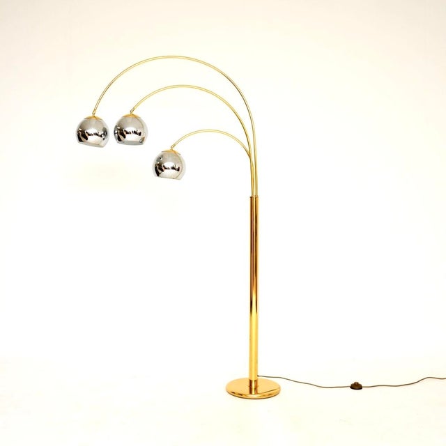 A stunning vintage Italian brass and chrome arc floor lamp, dating from the 1970’s. This is of outstanding quality, with a...