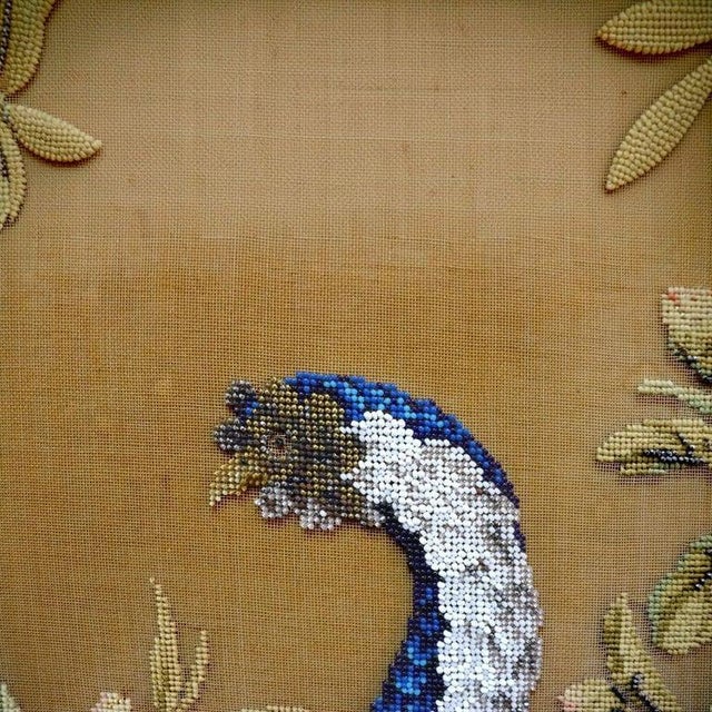 This antique Victorian fireplace screen, dating to approximately 1870, features a rich rosewood frame. The frame is...