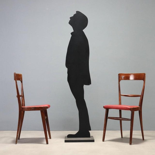Set of four vintage chairs from the 1950s-60s, crafted from stained beech wood. These seats, with their essential and...