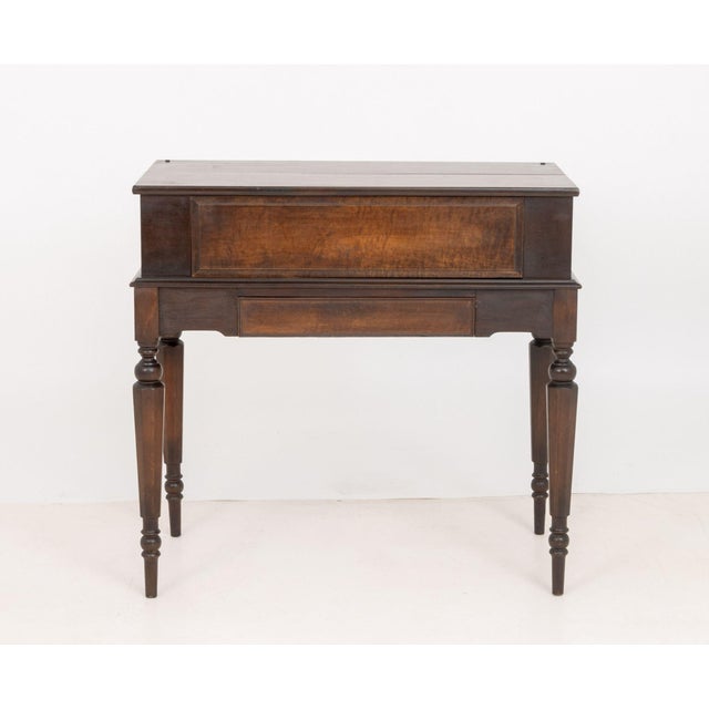 Edwardian Mahogany Spinet Desk, the top opening to sliding writing surface, drawers, and storage compartments. 36.25" H x...