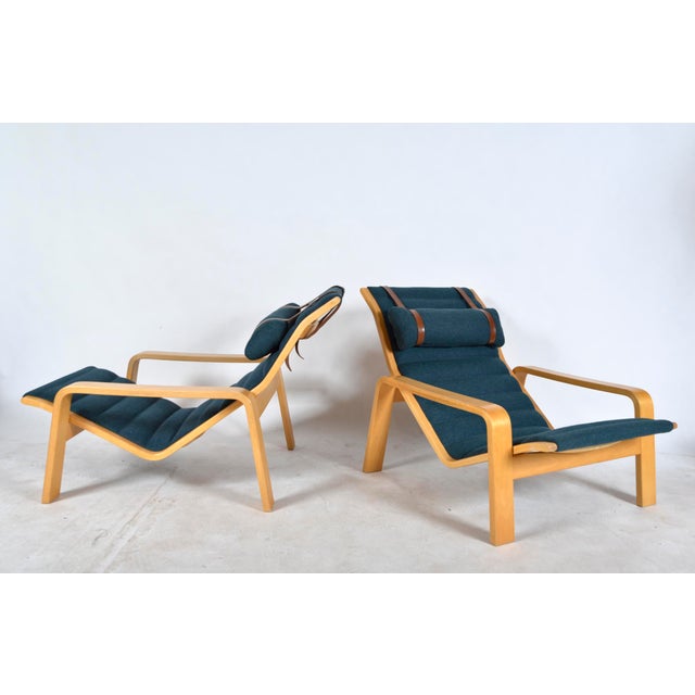 A stunning pair of newly upholstered birch wood pulkka lounge chairs by ilmari lappalainen for asko, finland 1960s. The...