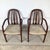 A pair of Danish Modern armchairs crafted in rich rosewood, bearing the official Danish Furniture Manufacturers’...