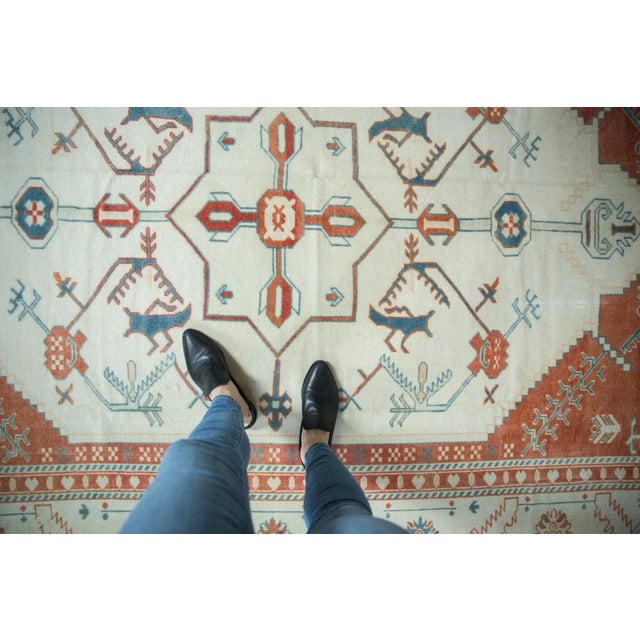 :: Simplistic center medallion in diamond shaped contour atop a covered field of floral arabesque with serrated character...