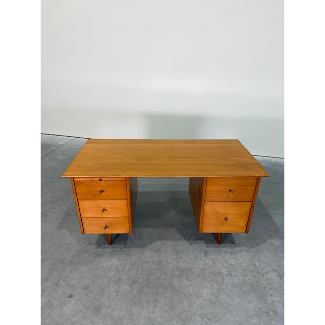 Mid Century Modern Paul McCobb Planner Group solid maple double pedestal desk. Ample storage space with 5 generously sized...