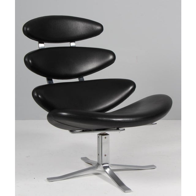Poul M. Volther lounge chair in original black leather. Frame of brushed steel. Model EJ-5 Corona, made by Erik Jørgensen....