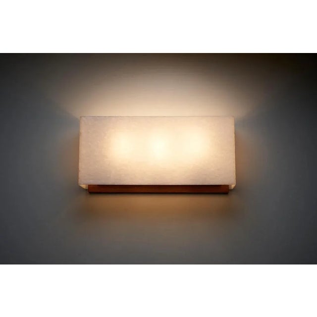Introducing the Large Wall Lamp with Textured Diffuser and Teak Frame, a remarkable piece crafted by Kontakt-Werkstätten...