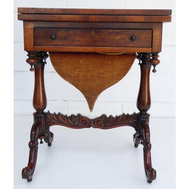 For sale is a good quality Victorian rosewood games table. The table has an inlaid top which swivels and folds over to...