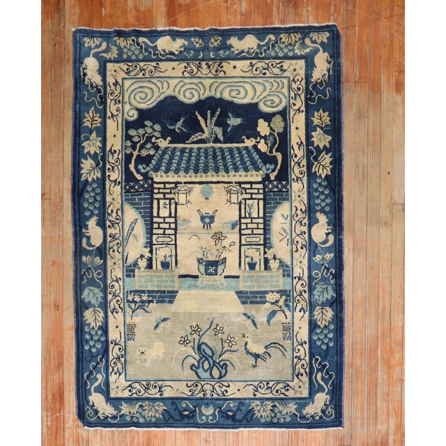An early 20th-century Chinese Peking carpet in tan and blue colors featuring a whimsical motif. circa 1920 measures: 4'1''...