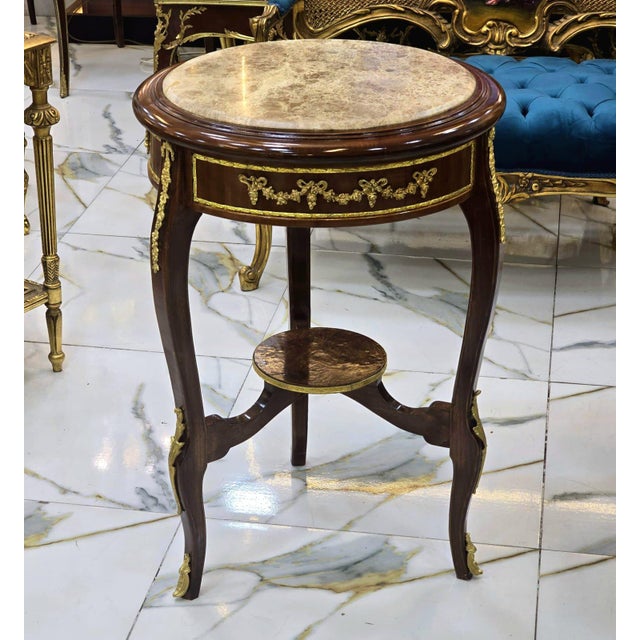 This Baroque style side table is a luxurious statement piece that brings classical French elegance to any interior....