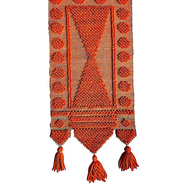 Offered is a mid 20th Century handwoven textile wall hanging in the style of Don Freedman. It features thick orange wool...