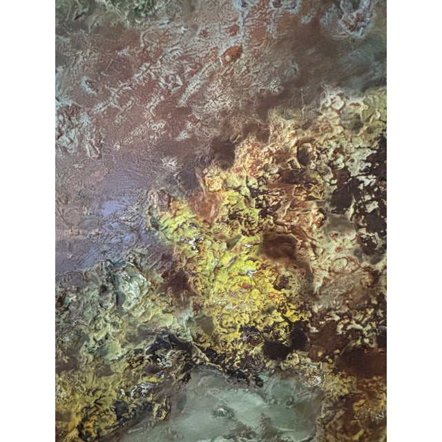 1960s painting with heavily gessoed relief of a celestial looking abstract. In shades of blue, yellow and browns. Painted...