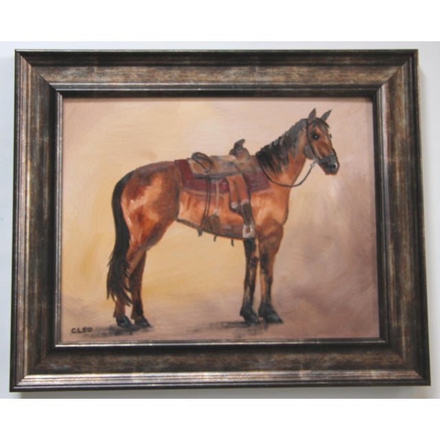 Horse portrait with a Western saddle, and ready to ride into the American landscape. In shades of brown, sienna, black,...